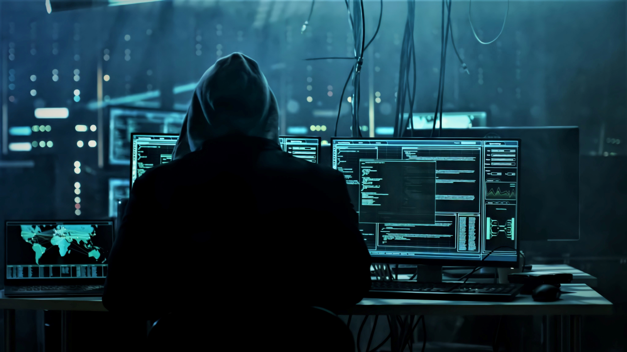 wallpapersden.com anonymous hacker working 1280x720